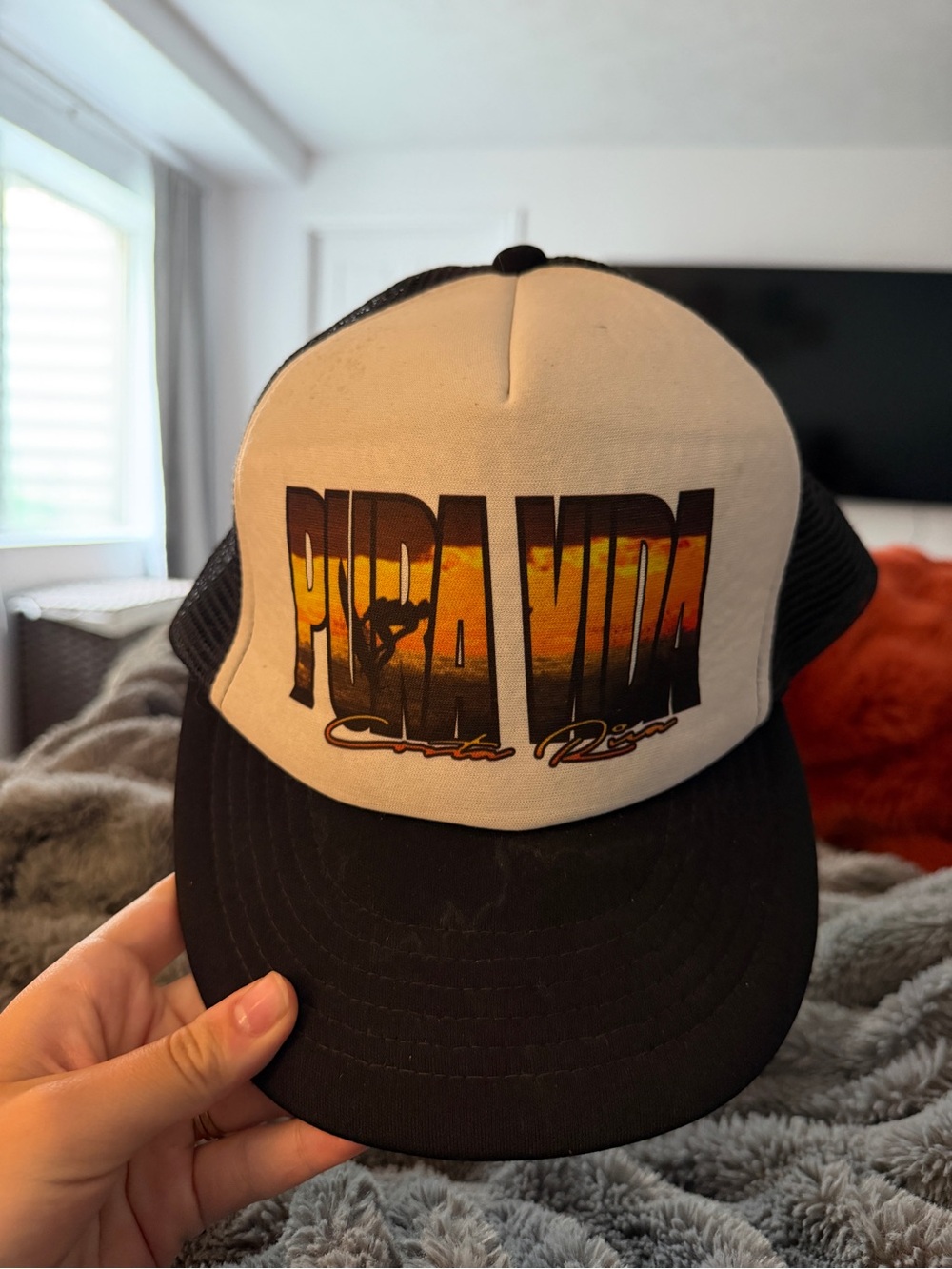 Pura Vida Black and Cream Sunset Logo Trucker Hat